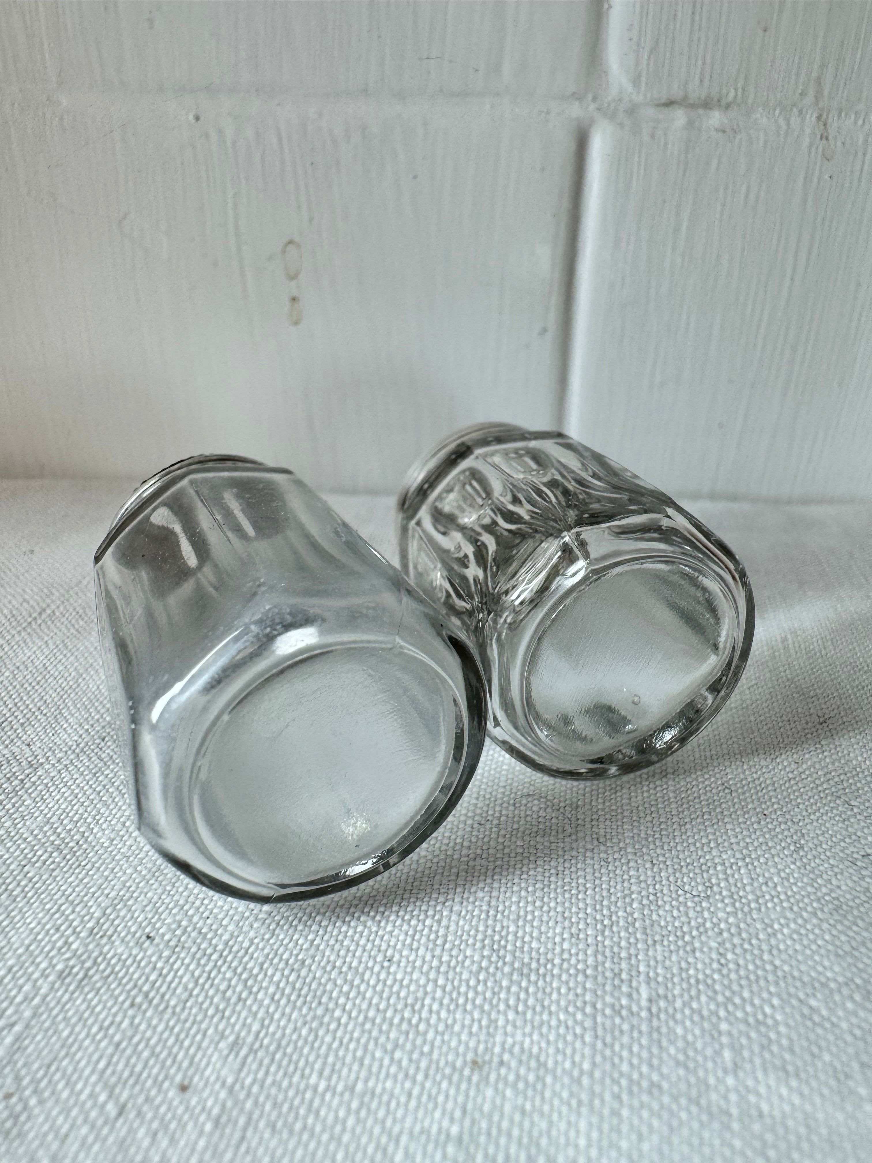 Pair of antique/vintage sterling silver topped salt and pepper pots with faceted glass