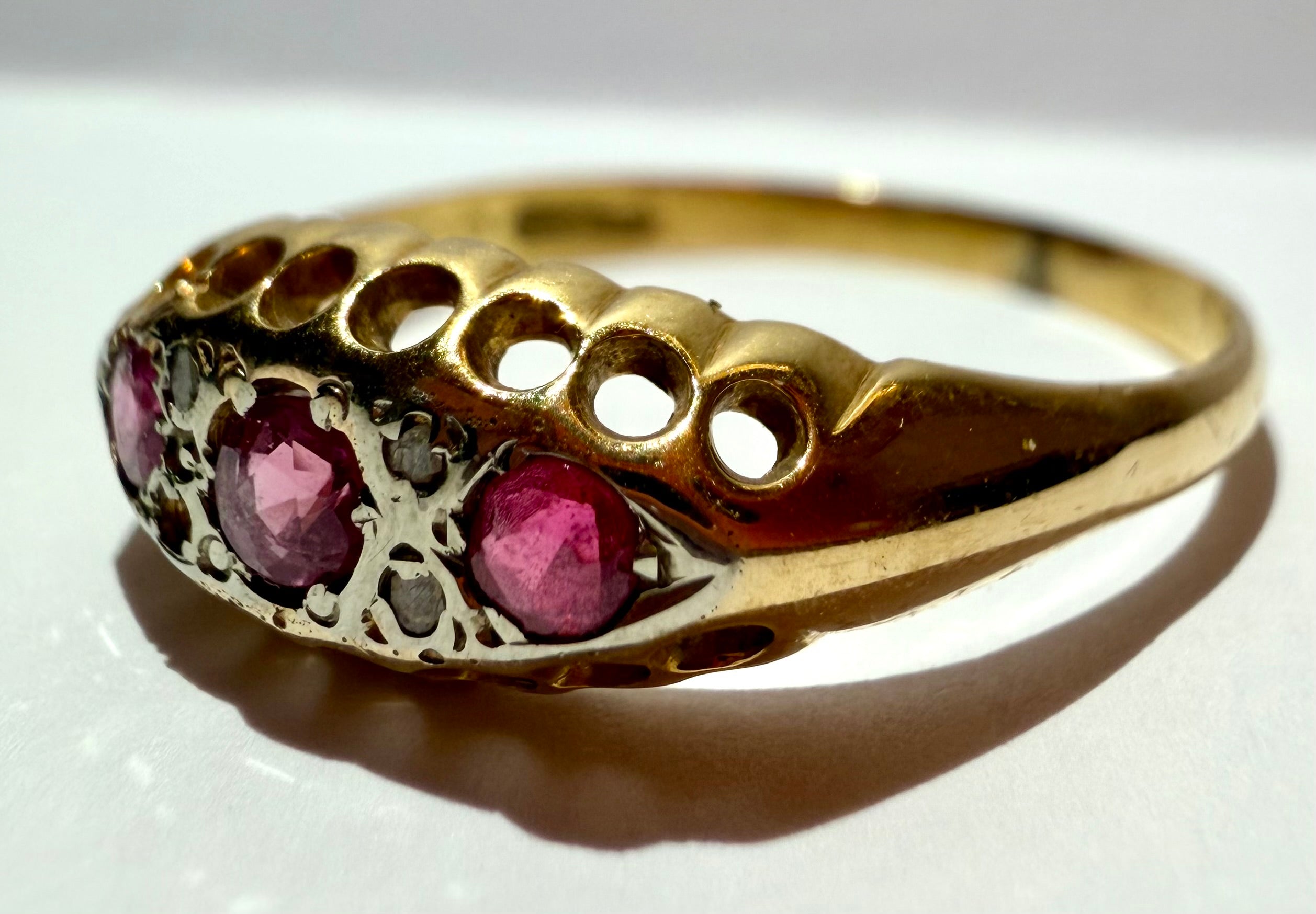 Lot 12: 18ct Ruby Trilogy Yellow Gold Ring
