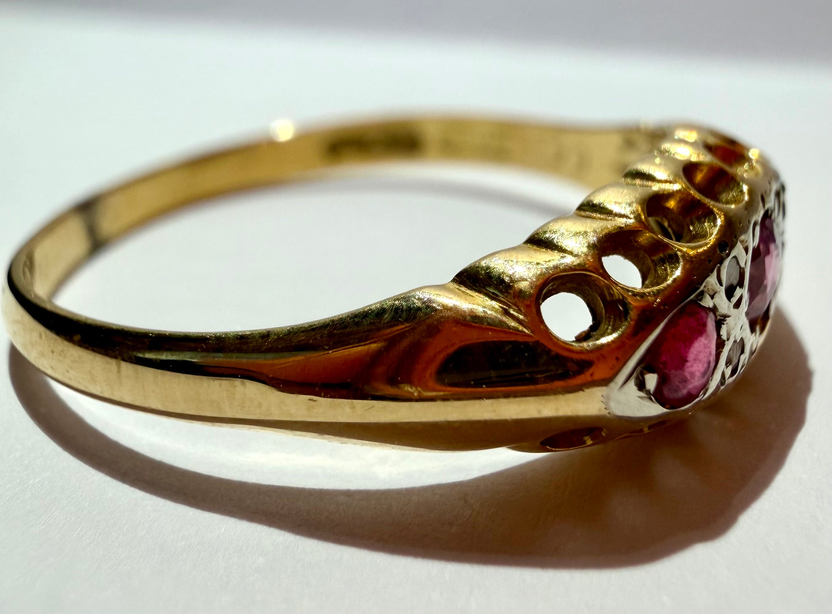 Lot 12: 18ct Ruby Trilogy Yellow Gold Ring