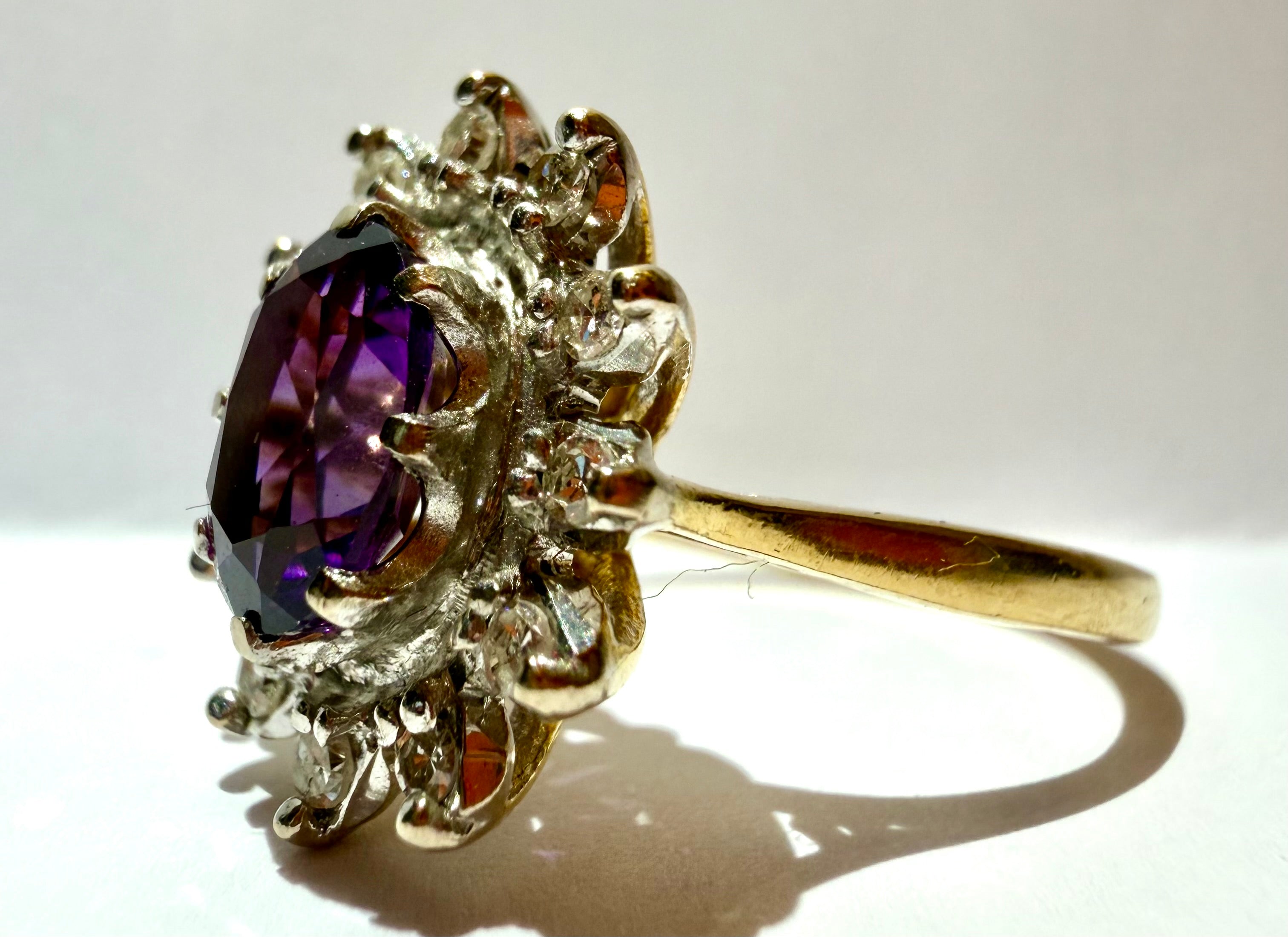 Lot 85: 18ct Yellow Gold Platinum Amethyst Diamond Halo Ring