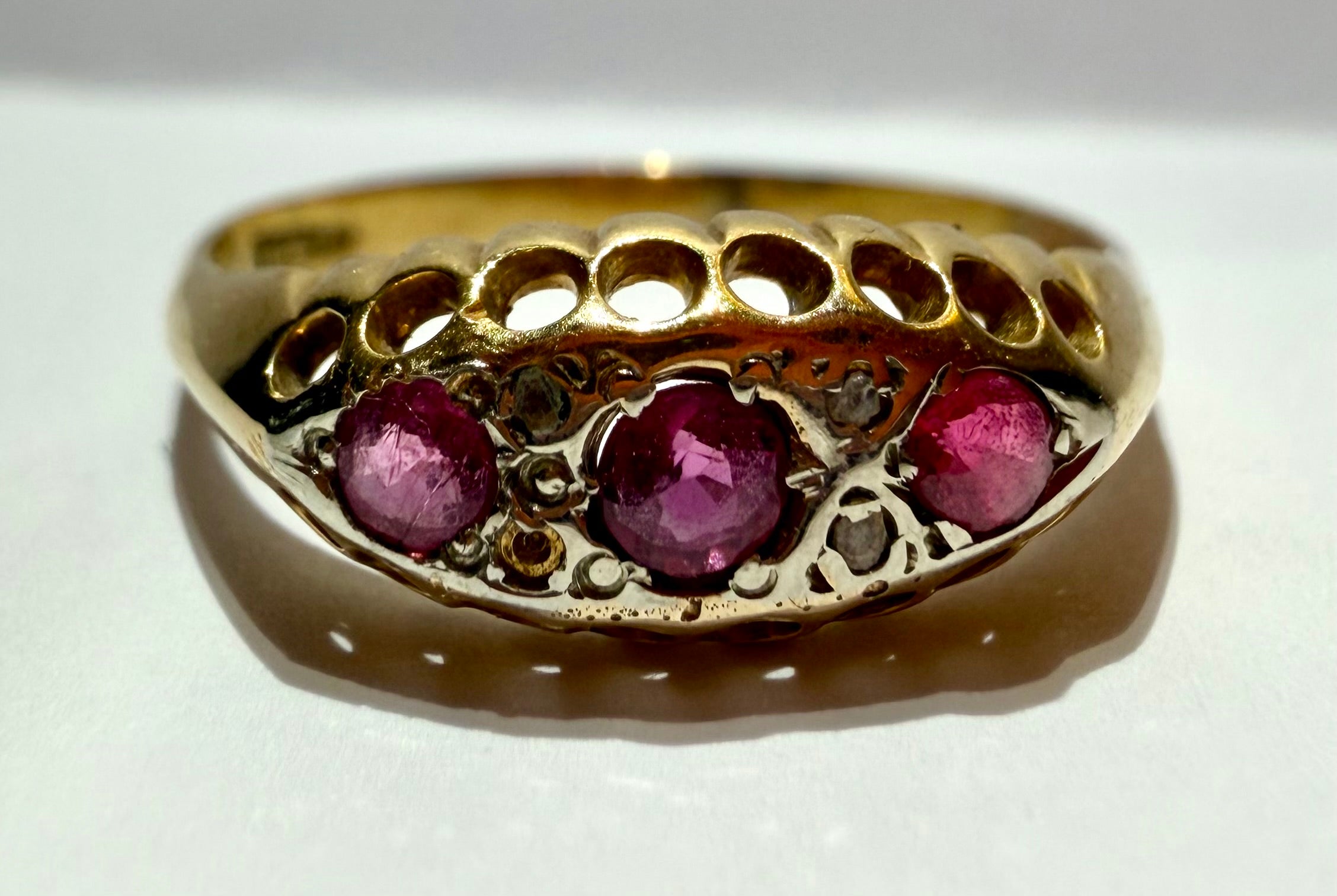 Lot 12: 18ct Ruby Trilogy Yellow Gold Ring