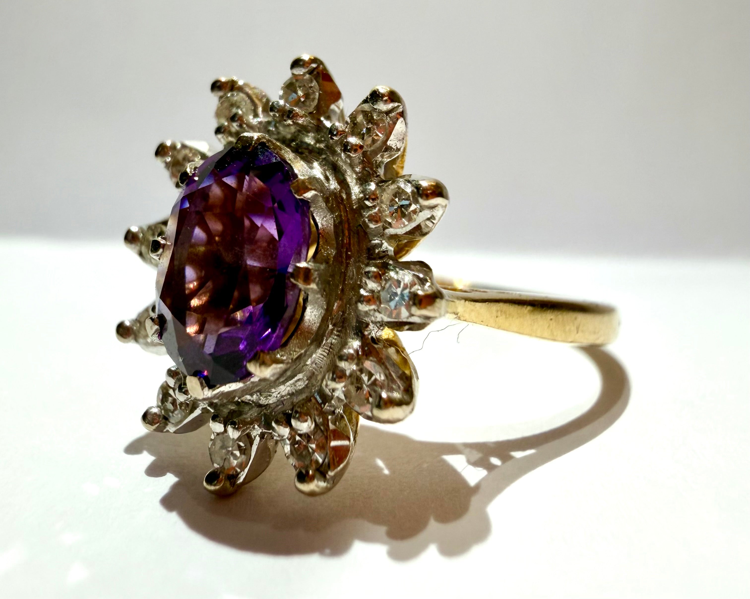 Lot 85: 18ct Yellow Gold Platinum Amethyst Diamond Halo Ring