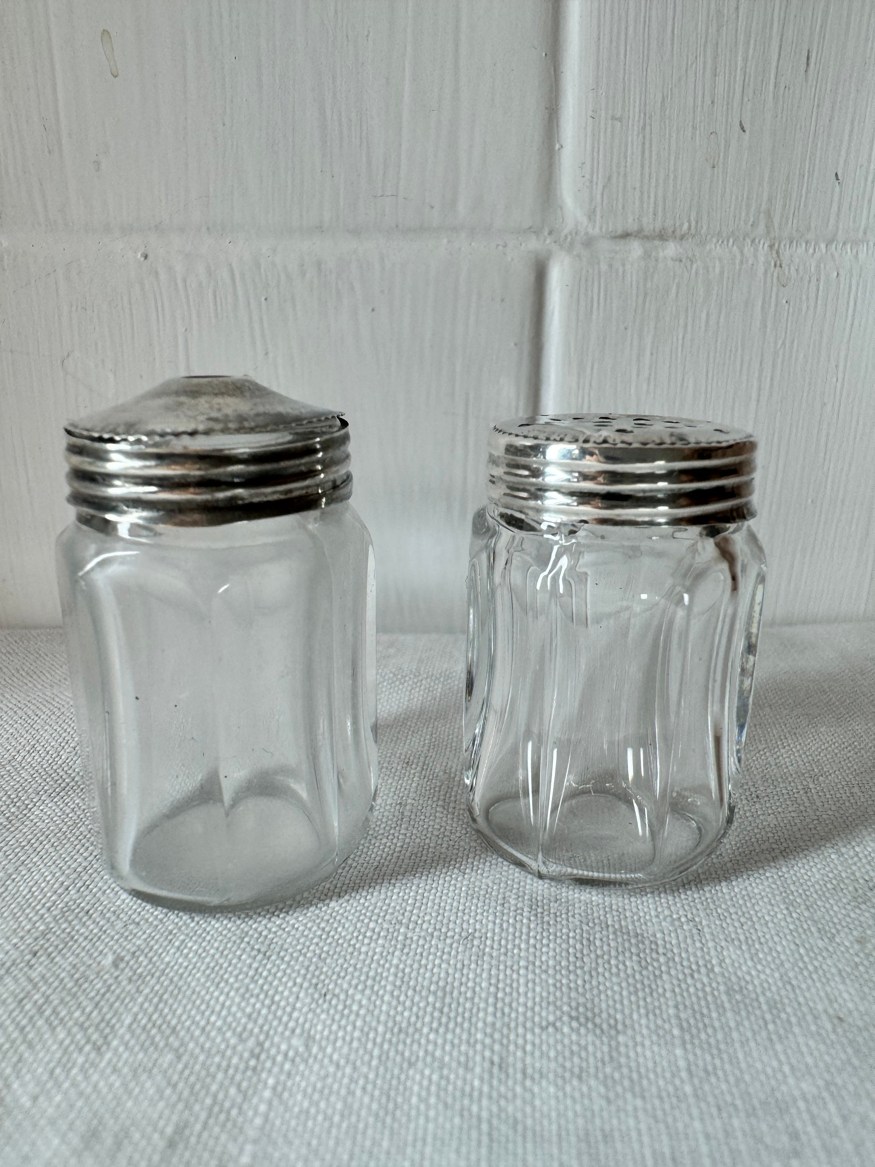 Pair of antique/vintage sterling silver topped salt and pepper pots with faceted glass