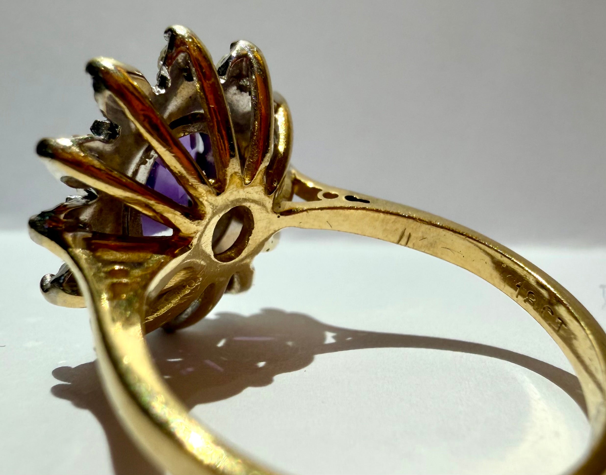 Lot 85: 18ct Yellow Gold Platinum Amethyst Diamond Halo Ring